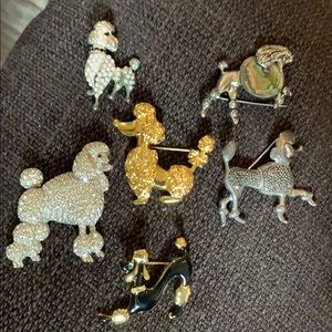 Poodle brooches.